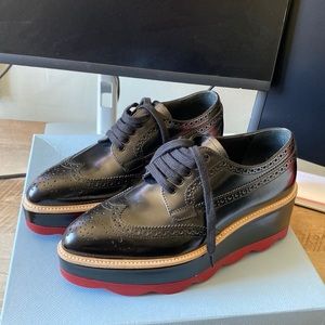 Prada Scalloped Lace Up Platforms